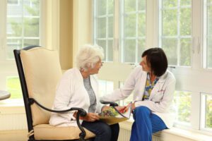 image of nurse and resident at Sunnyside Manor Senior Living in Wall NJ